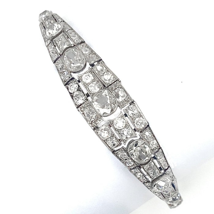 An Art Déco platinum, brilliant-cut and cushion-cut diamond bracelet. France, 1930.