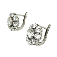 A pair of platinum and diamond daisy earrings, 1960 c.a.