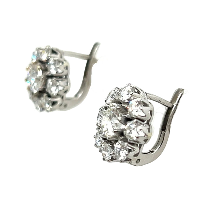 A pair of platinum and diamond daisy earrings, 1960 c.a.