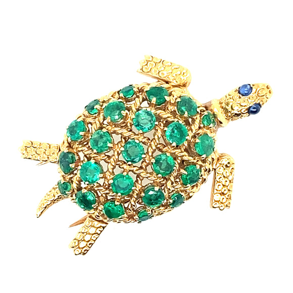 Spilla in oro giallo con smeraldi colombiani e zaffiri cabochon, 1950 c.a. 