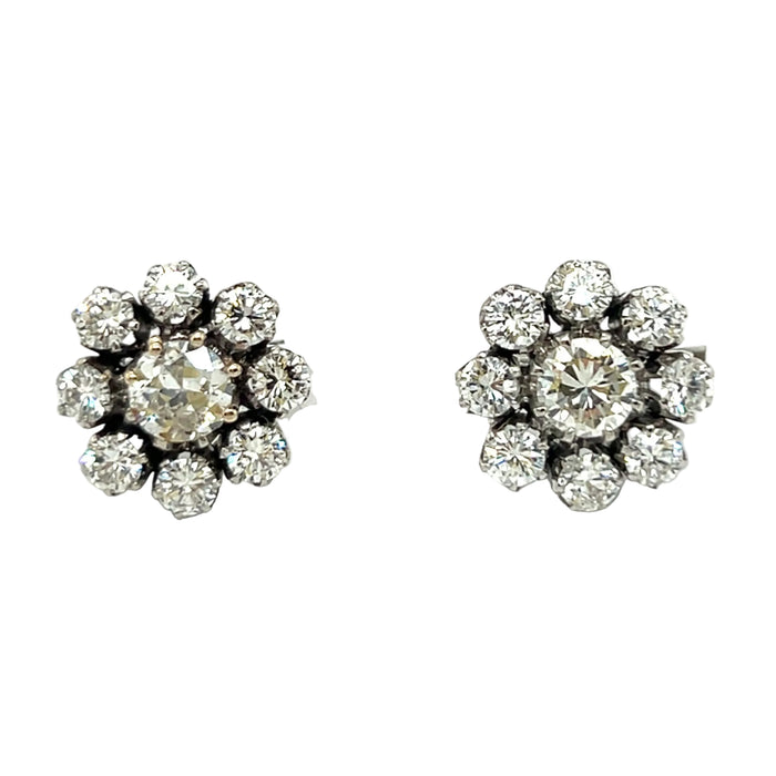 A pair of platinum and diamond daisy earrings, 1960 c.a.