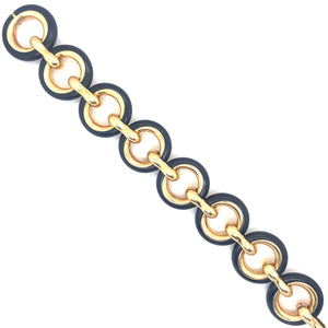 Particolare bracciale VanCleef a catena in oro giallo e legno