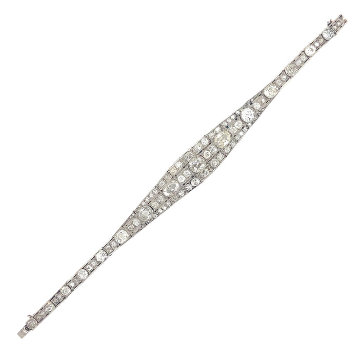 An Art Déco platinum, brilliant-cut and cushion-cut diamond bracelet. France, 1930.