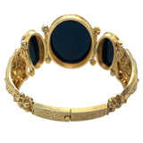 Bracciale semi rigidi in oro giallo con cammei su agata raffiguranti le tre grazie. 