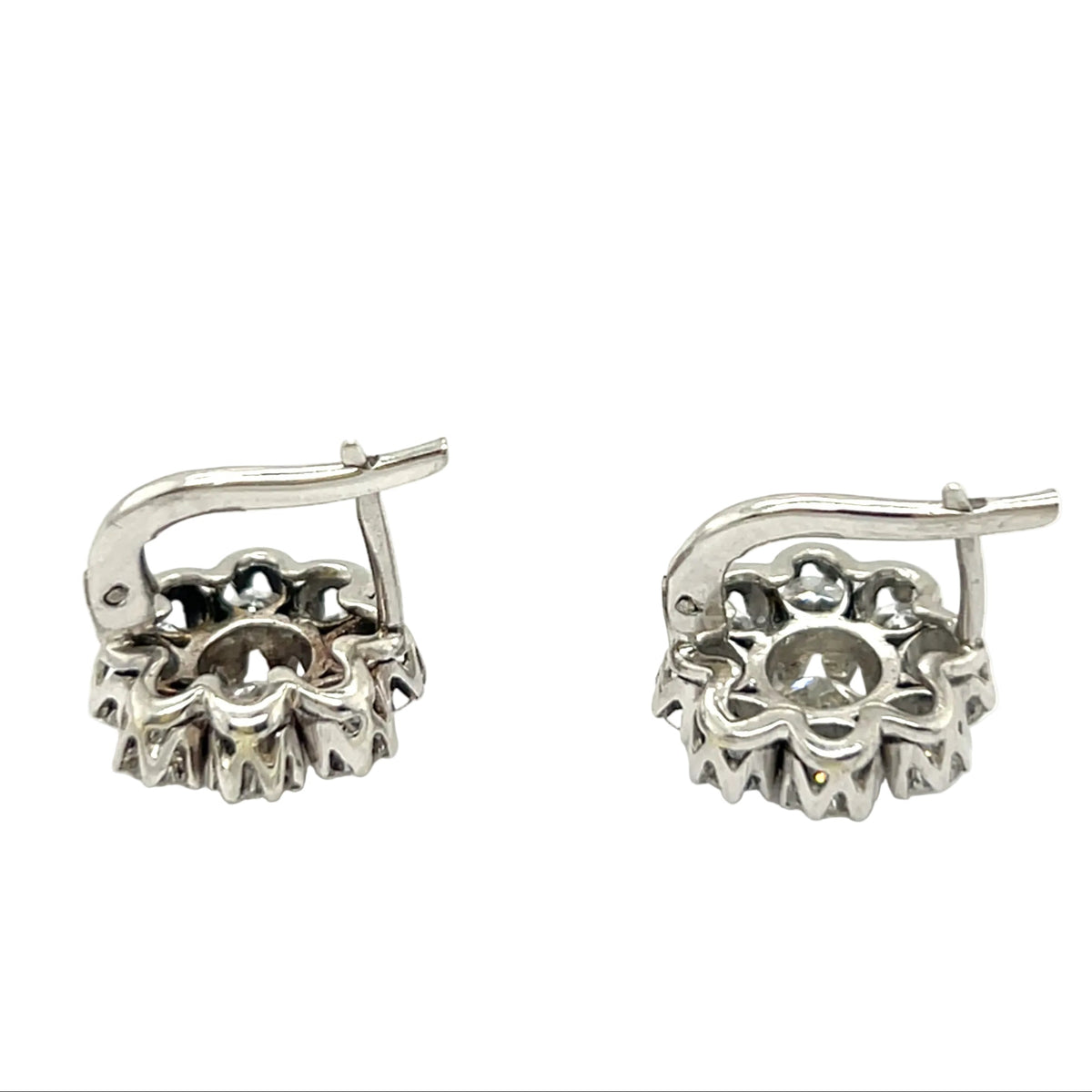 A pair of platinum and diamond daisy earrings, 1960 c.a.
