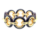 Particolare bracciale VanCleef a catena in oro giallo e legno