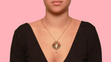 A very rare Art Nouveau gold, silver, diamond and plique à jour enamel pendant with a natural pearl.