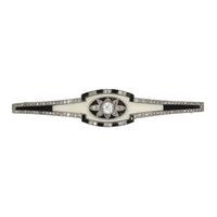 An Art Deco platinum, diamond, onyx and bone brooch, Cartier, Paris, 1925 c.a.