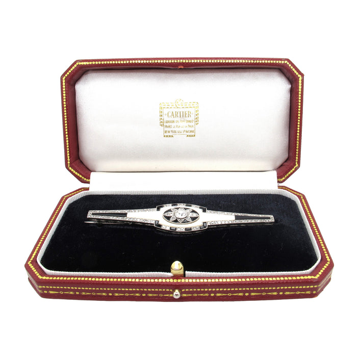 An Art Deco platinum, diamond, onyx and bone brooch, Cartier, Paris, 1925 c.a.