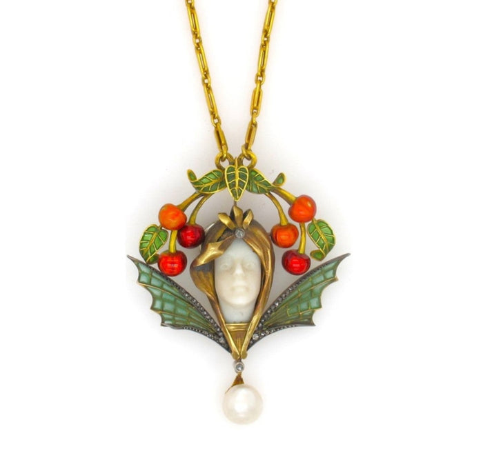 Un rarissimo pendente Art Nouveau in oro, argento, diamanti e smalto plique à jour con una perla naturale.