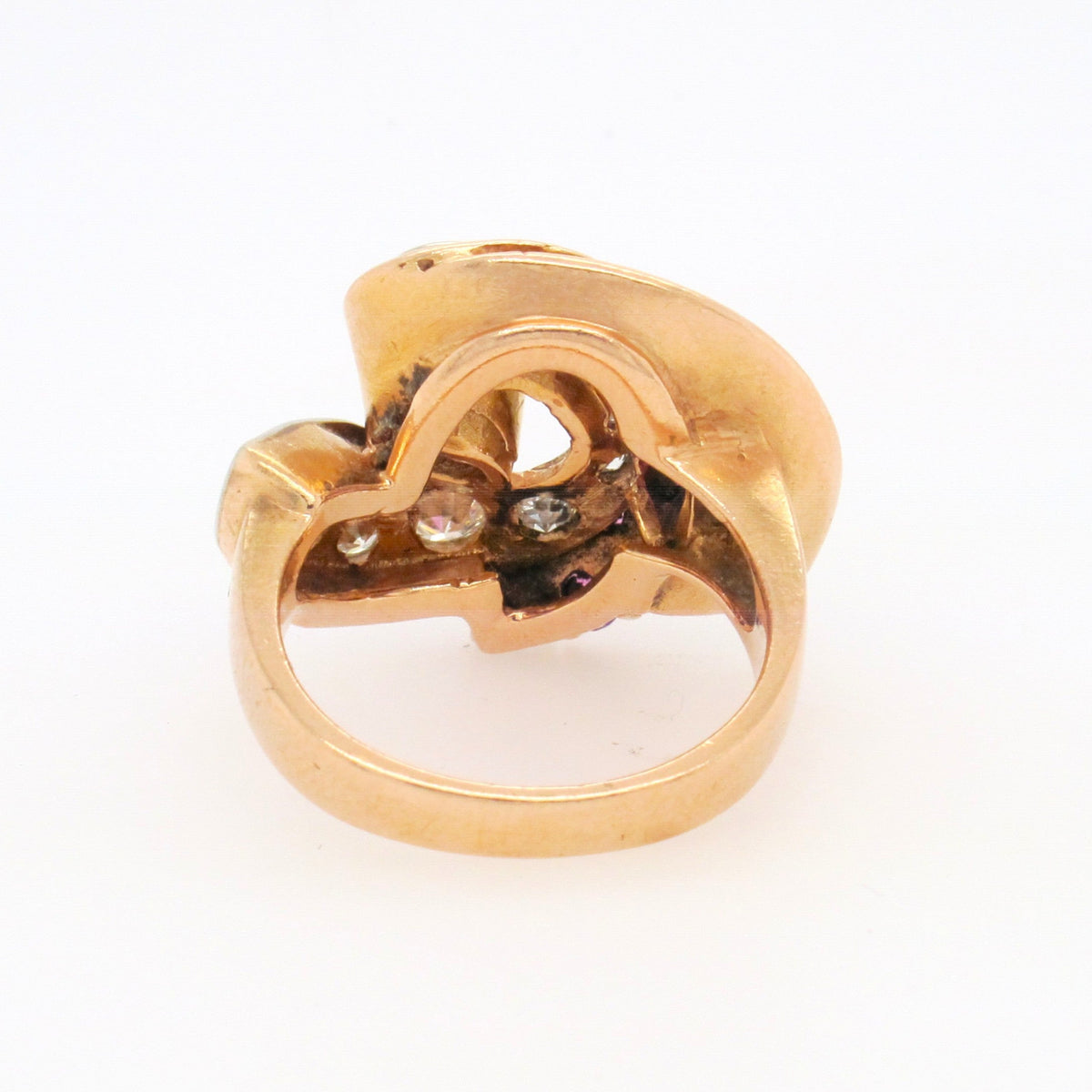 A yellow gold, diamond and ruby ring.
