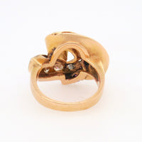 A yellow gold, diamond and ruby ring.