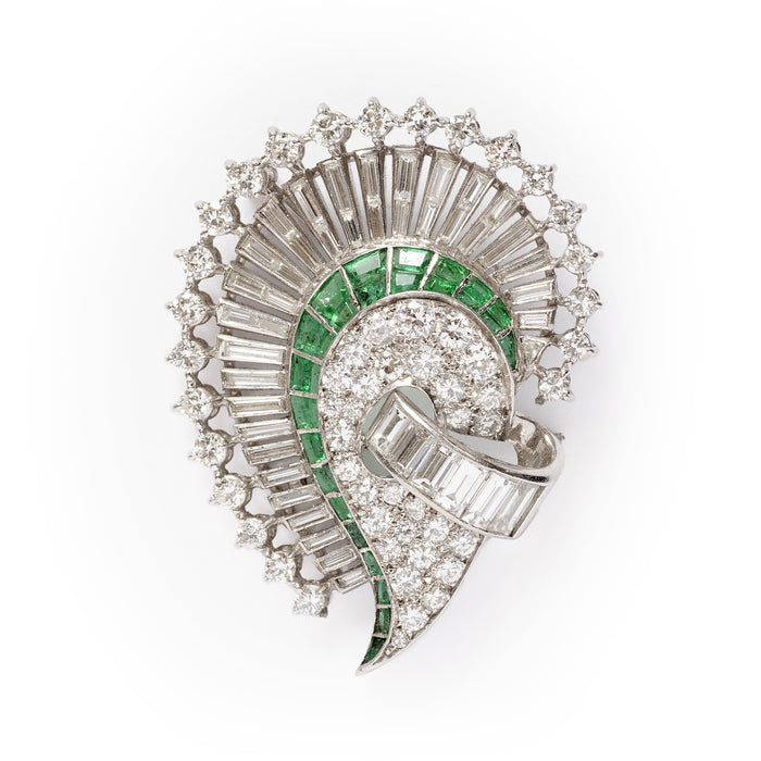 An Art Déco platinum, diamond and emerald brooch. 1925 circa
