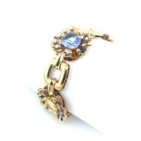 A yellow gold, diamond and yellow/blue sapphire bracelet. Period 1950 circa