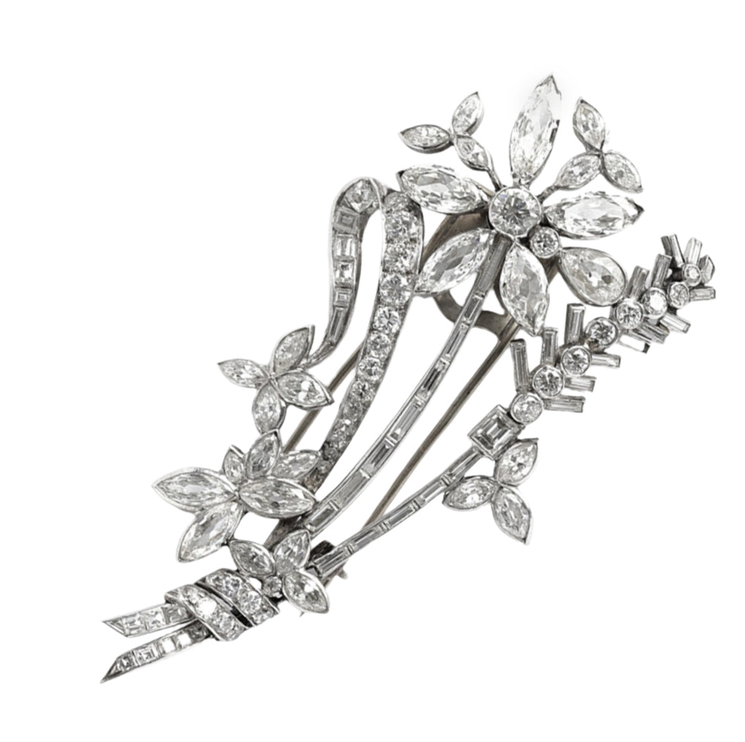 An Art Déco platinum and diamond brooch in the shape of a flower branch. Kutchinsky, London 1830 circa