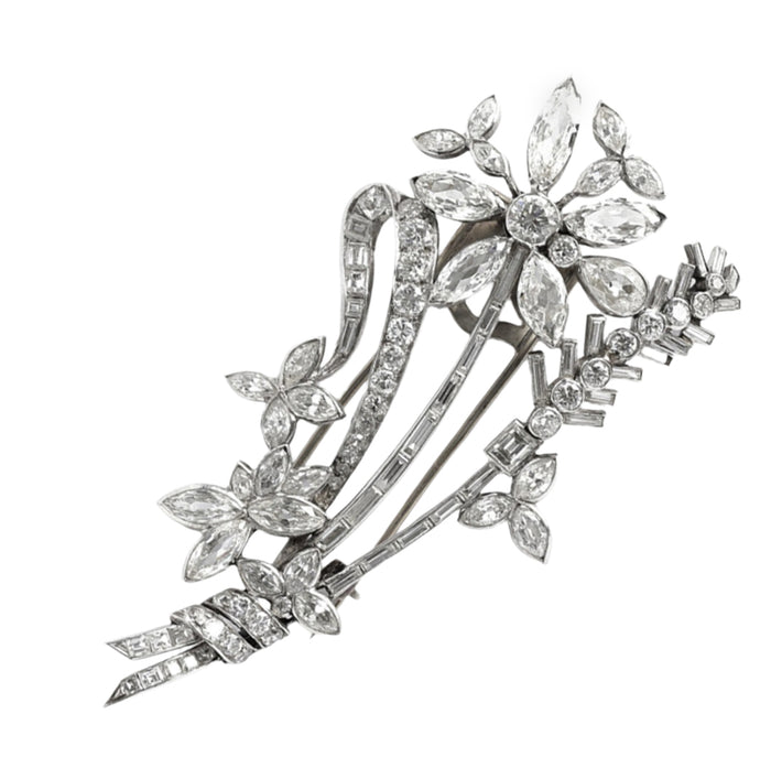 An Art Déco platinum and diamond brooch in the shape of a flower branch. Kutchinsky, London 1830 circa