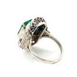 An Art Déco platinum diamond and emerald ring. 1930 c.a.