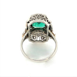 An Art Déco platinum diamond and emerald ring. 1930 c.a.