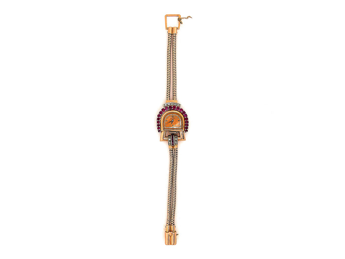 A retro Paul Dititshiem 14K rose gold dress watch with rubies and diamonds. Circa 1940