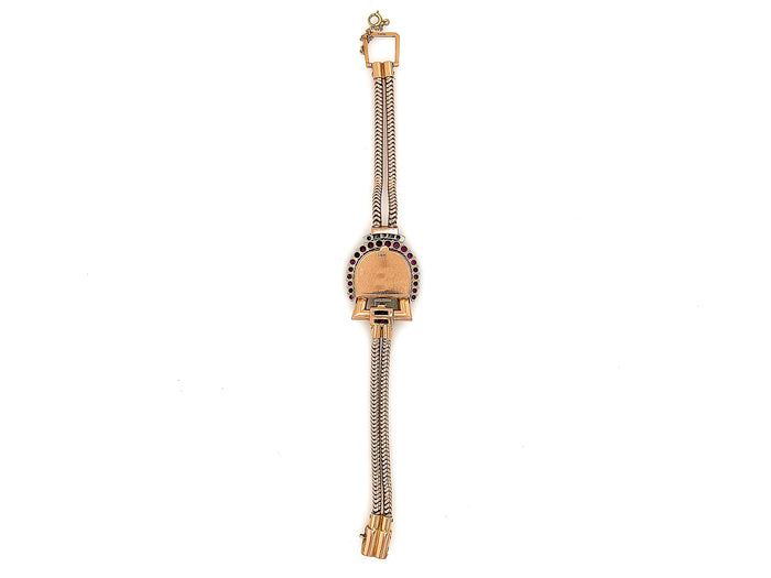 A retro Paul Dititshiem 14K rose gold dress watch with rubies and diamonds. Circa 1940