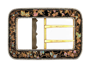 A very rare yellow gold and platinum belt buckle with black enameled with mother-of-pearl leaves. Rose-cut diamond frame. Cartier, Paris, 1910 c.a.