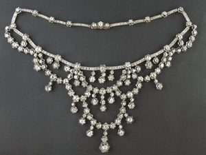 A XIX Century silver topped, Yellow gold and old-cut diamond necklace of draperie design.
