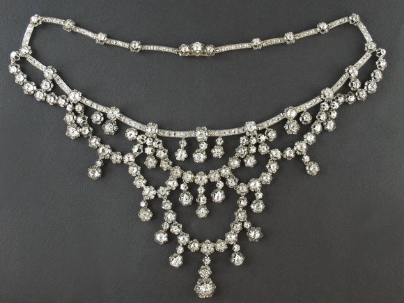 A XIX Century silver topped, Yellow gold and old-cut diamond necklace of draperie design.