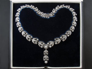 A late XIX Century silver topped, Yellow gold and old-cut diamonds garland necklace.
