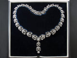 A late XIX Century silver topped, Yellow gold and old-cut diamonds garland necklace.