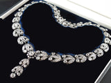 A late XIX Century silver topped, Yellow gold and old-cut diamonds garland necklace.