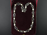 A Victorian XIX Century silver topped, Yellow gold, old-cut diamond and natural pearl necklace. 
