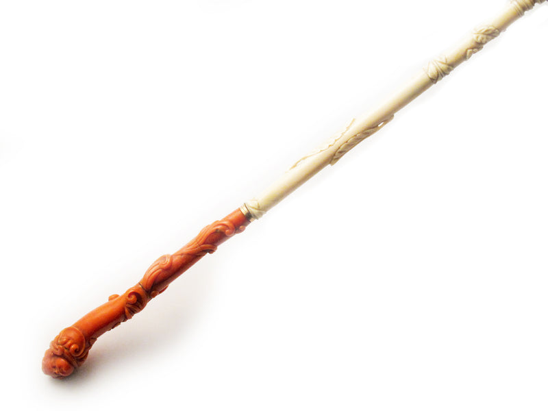 An antique  ivory and carved coral parasol. Southern Italy. 1860.