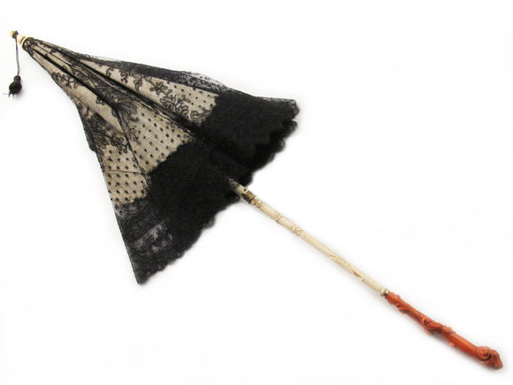 An antique  ivory and carved coral parasol. Southern Italy. 1860.