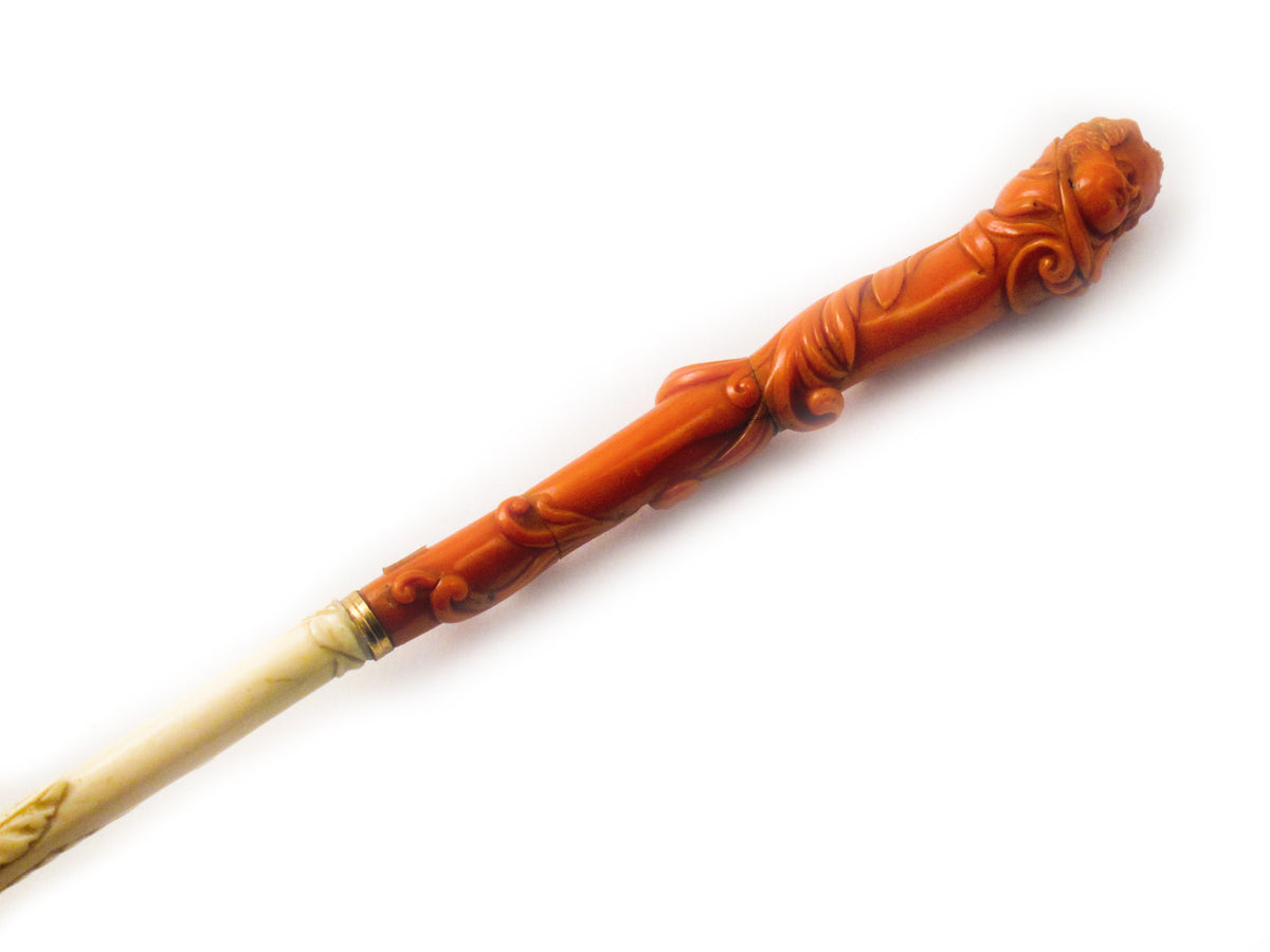 An antique  ivory and carved coral parasol. Southern Italy. 1860.