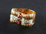 A yellow gold, diamond and ruby ring.