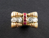 A yellow gold, diamond and ruby ring.