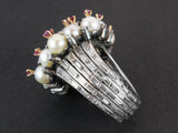 A platinum diamond, pearl and ruby cocktail ring. 1960 circa