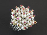 A platinum diamond, pearl and ruby cocktail ring. 1960 circa