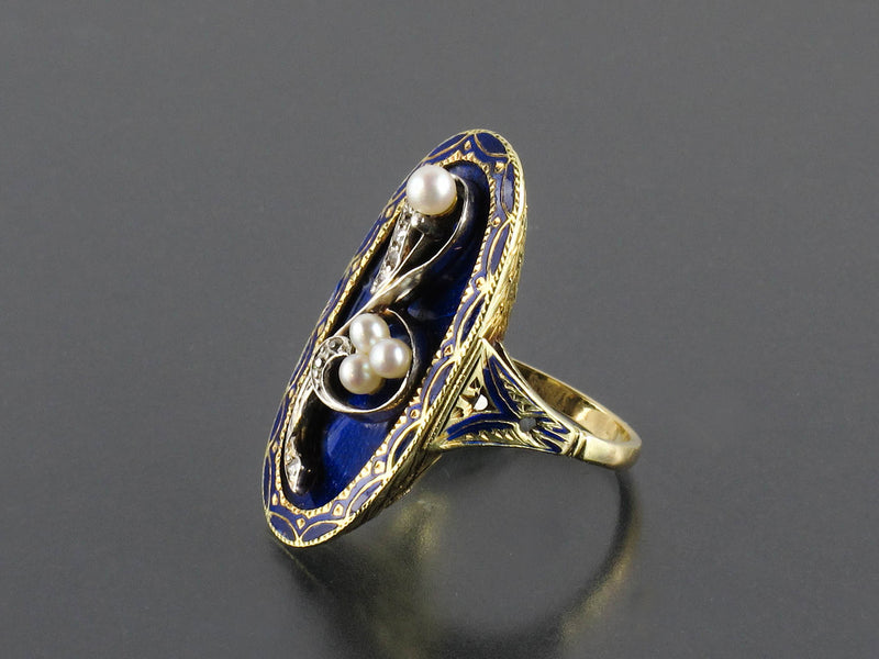 A XIX Century Victorian blue enameled gold, diamond and pearl ring.