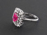 A classical platinum and diamond ring, centering a beautiful Burma ruby, weighting 3.52 with a gemological certificate stating that is of Myanmar (Burma) origin with no indication of heating. 1950 c.a.