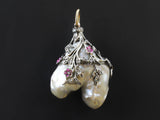 A Early 20th century natural pearl pendant with rose-cut diamonds and rubies