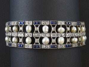 An Art Déco platinum, natural pearls, diamond and sapphire bracelet