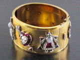 An Art Déco rare Yellow gold and platinum cuff bracelet with seven diamond and precious stone charms. USA, 1940 c.a.