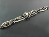 A beautiful silver topped, Yellow gold, old-cut diamond and natural pearl bracelet. France, XIX Century.
