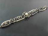 A beautiful silver topped, Yellow gold, old-cut diamond and natural pearl bracelet. France, XIX Century.
