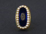 A Georgian XIX Century Yellow gold and silver ring with rose-cut diamonds and blue glass and natural pearls.