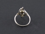 An Art Déco platinum, old cut diamond and natural perl ring