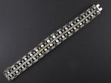 An Art Déco platinum, natural pearls, diamond and sapphire bracelet