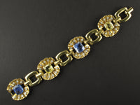 A yellow gold, diamond and yellow/blue sapphire bracelet. Period 1950 circa