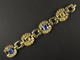 A yellow gold, diamond and yellow/blue sapphire bracelet. Period 1950 circa